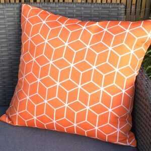 Orange cushion for teak garden furniture